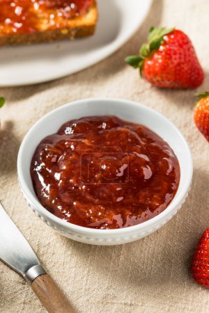 Photo for Organic Raw Red Strawberry Jam Jelly for Toast - Royalty Free Image