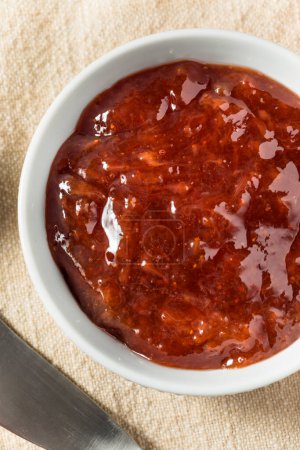 Photo for Organic Raw Red Strawberry Jam Jelly for Toast - Royalty Free Image