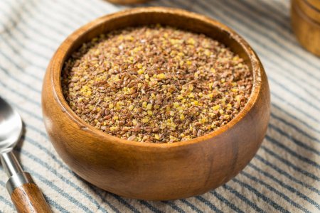 Photo for Organic Brown Dry Ground Flax Seeds in a Bowl - Royalty Free Image