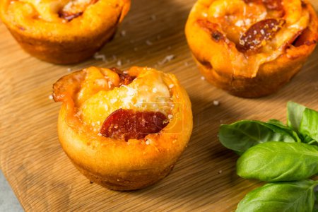 Photo for Homemade Italian Pizza Muffin Bites with Sauce and Pepperoni - Royalty Free Image