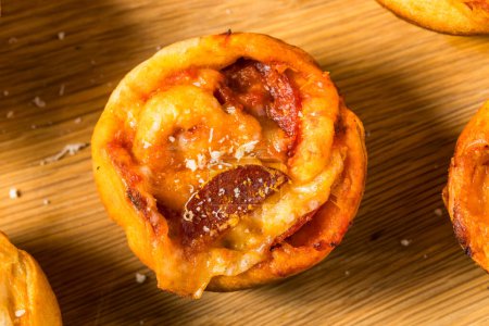 Photo for Homemade Italian Pizza Muffin Bites with Sauce and Pepperoni - Royalty Free Image