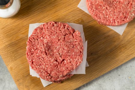 Photo for Raw Grass Fed Beef Hamburgers Ready to Cook - Royalty Free Image