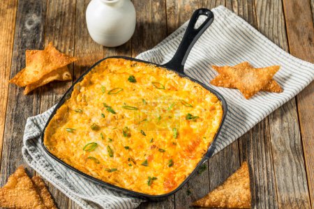 Photo for Warm Cheesy Crab Rangoon Appetizer Dip with Wonton Chips - Royalty Free Image