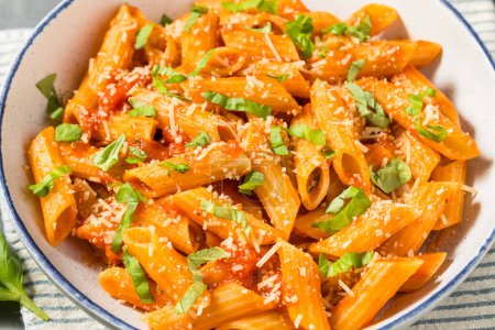 Photo for Italian Homemade Pennoni Pasta with Tomato Sauce and Basil - Royalty Free Image