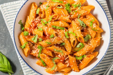 Photo for Italian Homemade Pennoni Pasta with Tomato Sauce and Basil - Royalty Free Image