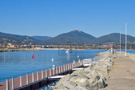 Photo for Breakwater port Cogolin winter day with mountain view - Royalty Free Image