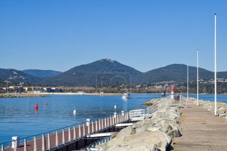Photo for Breakwater port Cogolin winter day with mountain view - Royalty Free Image