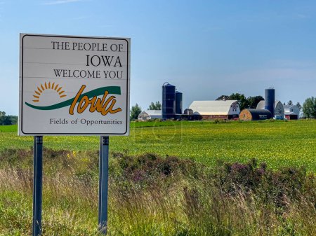 Photo for Welcome Sign for Iowa in front of a local Farm - Royalty Free Image