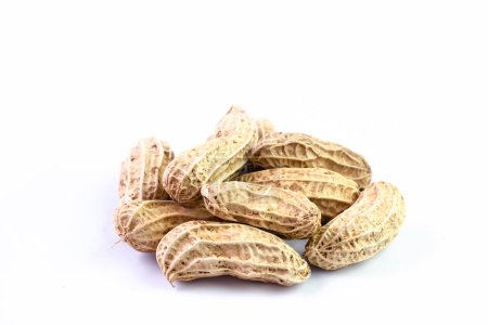 peanut, dried groundnut, nut pile on white