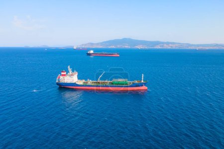 Photo for Oil chemical tanker carrier sea ship anchored in Aegean sea waiting entering port, Aerial view - Royalty Free Image