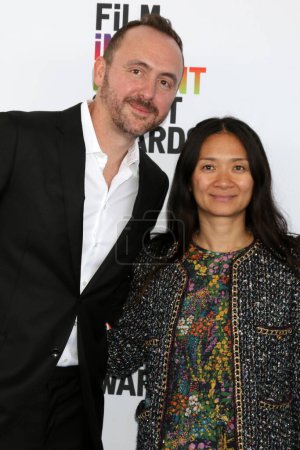 Photo for LOS ANGELES - MAR 4:  Nic Gonda, Chloe Zhao at the 2023 Film Independent Spirit Awards at the Tent on the Beach on March 4, 2023 in Santa Monica, CA - Royalty Free Image