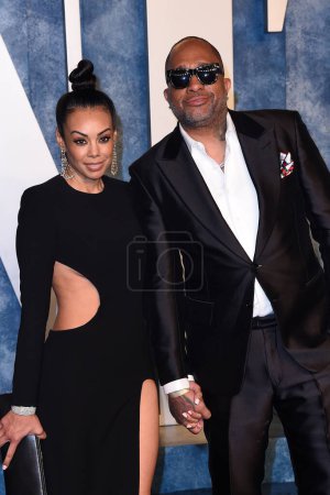 Photo for LOS ANGELES - MAR 12:  Brandi Padilla, Kenya Barris at the 2023 Vanity Fair Oscar Party at the Wallis Annenberg Center for the Performing Arts on March 12, 2023 in Beverly Hills, CA - Royalty Free Image