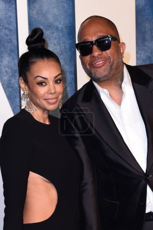 Photo for LOS ANGELES - MAR 12:  Brandi Padilla, Kenya Barris at the 2023 Vanity Fair Oscar Party at the Wallis Annenberg Center for the Performing Arts on March 12, 2023 in Beverly Hills, CA - Royalty Free Image