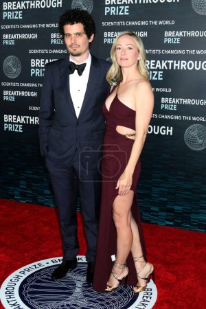 Photo for LOS ANGELES - APR 15:  Damien Chazelle, Olivia Hamilton at the 9th Breakthrough Prize Ceremony Arrivals at the Academy Museum of Motion Pictures on April 15, 2023 in Los Angeles, CA - Royalty Free Image