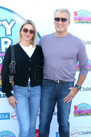 Photo for LOS ANGELES - NOV 5:  Emma Krokdal, Dolph Lundgren at the Party on the Pier at the Santa Monica Pier on November 5, 2023 in Santa Monica, CA - Royalty Free Image