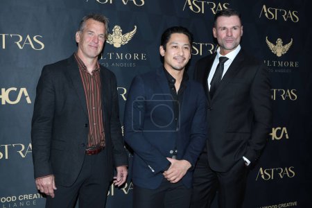 Photo for LOS ANGELES - JAN 6:  Scott Rogers, Jeremy Marinas, Stephen Dunlevy at the 7th Astra Film Awards at the Biltmore Hotel on January 6, 2024 in Los Angeles, CA - Royalty Free Image