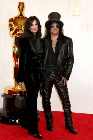 Photo for LOS ANGELES - MAR 10:  Meegan Hodges, Slash at the 96th Academy Awards Arrivals at the Dolby Theater on March 10, 2024 in Los Angeles, CA - Royalty Free Image