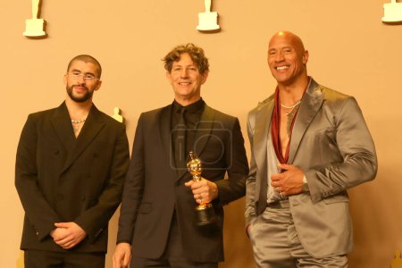 Photo for LOS ANGELES - MAR 10:  Bad Bunny, Jonathan Glazer, Dwayne Johnson at the 96th Academy Awards Press Room at the Dolby Theater on March 10, 2024 in Los Angeles, CA - Royalty Free Image