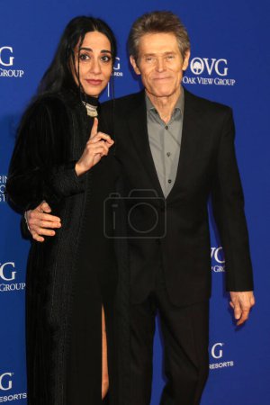 Photo for LOS ANGELES - JAN 4:  Giada Colagrande, Willem Dafoe at the 2024 Palm Springs International Film Festival Gala Arrivals at the Palm Springs Convention Center on January 4, 2024 in Palm Springs, CA - Royalty Free Image