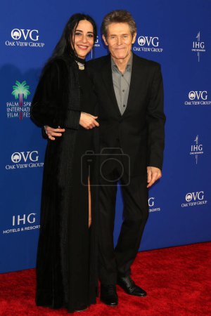 Photo for LOS ANGELES - JAN 4:  Giada Colagrande, Willem Dafoe at the 2024 Palm Springs International Film Festival Gala Arrivals at the Palm Springs Convention Center on January 4, 2024 in Palm Springs, CA - Royalty Free Image