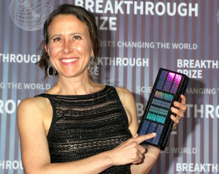 Photo for LOS ANGELES, USA - APRIL 13:  Anne Wojcicki, purse with DNA code detail at the 10th Annual Breakthrough Prize Ceremony at the Academy Museum of Motion Pictures on April 13, 2024 in Los Angeles, CA - Royalty Free Image