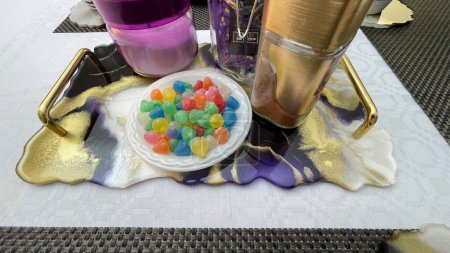 Foto de Crafty and colorful tray with candies and stuff - Imagen libre de derechos