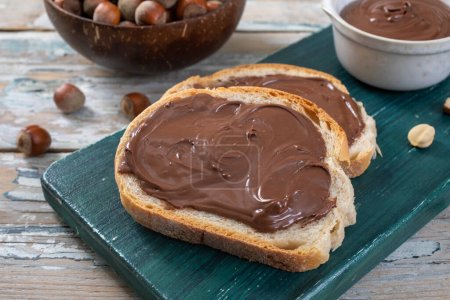 Photo for Chocolate spread with spread spread spread and spread on the board. - Royalty Free Image
