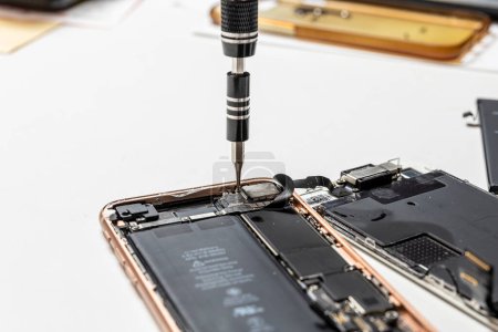 Photo for Smartphone battery replacement, repair, LCD panel replacement - Royalty Free Image