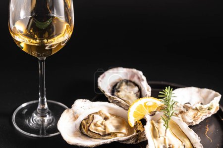 Photo for Very fresh raw oysters and white wine - Royalty Free Image