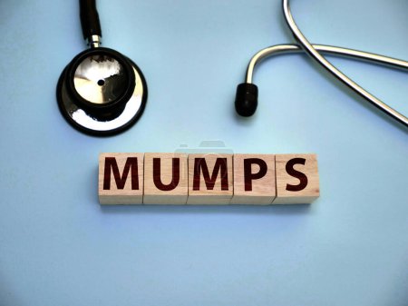 Photo for Mumps, text words typography written on wooden letter, health and medical concept - Royalty Free Image