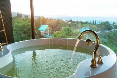 Photo for Jacuzzi tub with mountain view and sunset light - Royalty Free Image