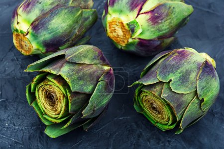 Photo for Unopened raw artichoke buds, food. Italian cuisine - Royalty Free Image