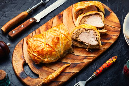 Photo for Popular delicious meat food is wellington meat, meat wrapped in dough. British food - Royalty Free Image