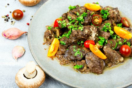 Photo for Chicken liver stewed with mushrooms and tomatoes. Georgian recipe - Royalty Free Image