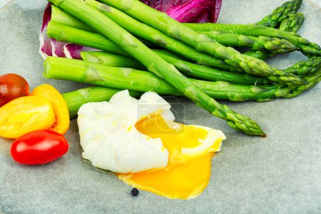 Photo for Salad with asparagus, lettuce, tomato and poached egg. healthy lunch - Royalty Free Image