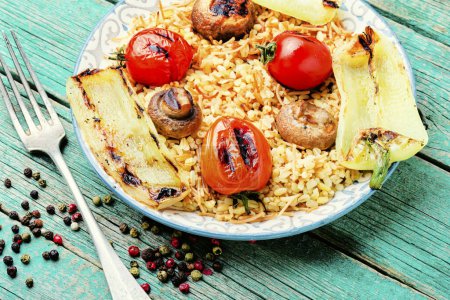 Photo for Grilled tomato, bell pepper and grilled mushroom with rice for garnish in plate on wooden table - Royalty Free Image