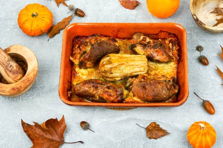 Photo for Roasted meat rolls stuffed with pumpkin and cheese in the oven dish. Top view - Royalty Free Image