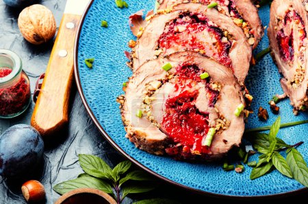 Photo for Sliced meatloaf stuffed with plums. Autumn meat recipe, roulade. - Royalty Free Image