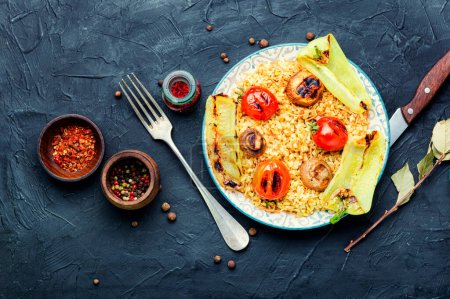 Photo for Grilled tomato, pepper and grilled mushroom lunch with rice for garnish. Concrete background. - Royalty Free Image
