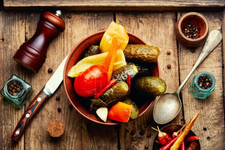 Photo for Assorted vegetable pickles, spicy pickled on a rustic wooden background - Royalty Free Image
