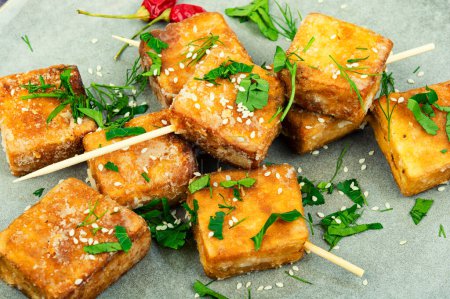 Photo for Skewers with roasted pieces tofu cheese. Close up - Royalty Free Image