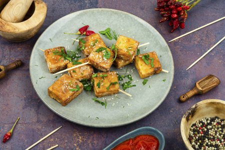 Photo for Grilled tofu cheese skewers on the plate - Royalty Free Image