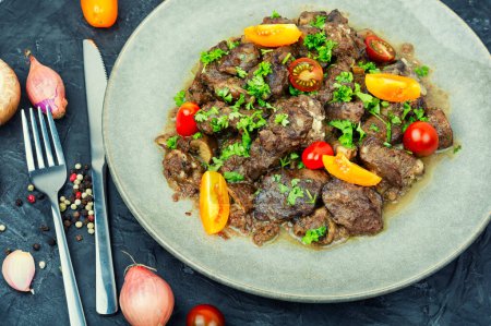 Photo for Chicken liver prepared with mushrooms and tomatoes. Liver in Georgian - Royalty Free Image