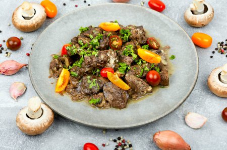 Photo for Chicken liver stewed with mushrooms and tomatoes. Georgian recipe - Royalty Free Image