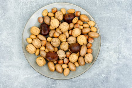 Photo for Walnut, chestnut, almond, hazelnut on the table.Healthy food and snacks - Royalty Free Image