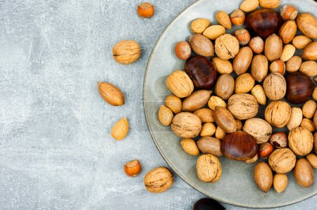 Photo for Walnut, chestnut, almond, hazelnut on the table.Healthy food. Top view with copy space - Royalty Free Image
