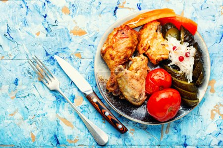 Photo for Fried chicken pieces garnished with salted vegetables - Royalty Free Image