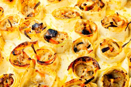 Téléchargez les photos : Vegetables baked with cheese in pita bread. Casserole. Close up - en image libre de droit
