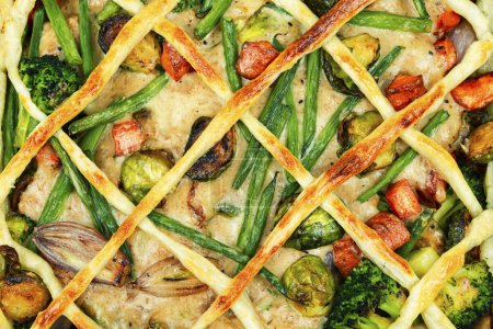 Foto de Meat pie with brussels sprouts, pumpkin and broccoli. Food background - Imagen libre de derechos