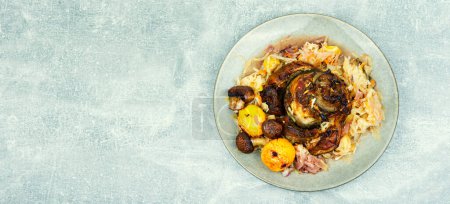 Photo for Roasted pork knuckle eisbein with cabbage and apples. Pork leg in the oven dish. German food, copy space - Royalty Free Image